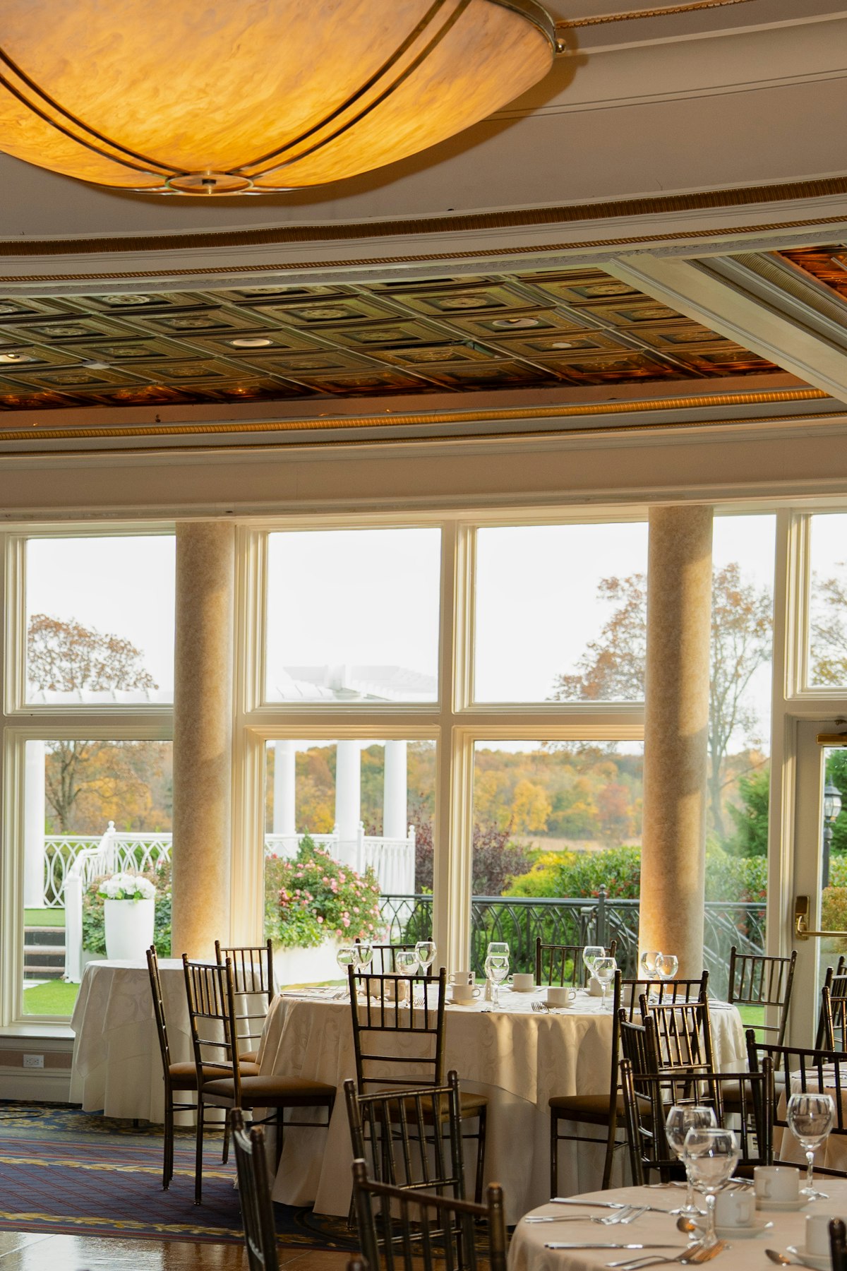 Reception hall with rows of coordinated wedding tables